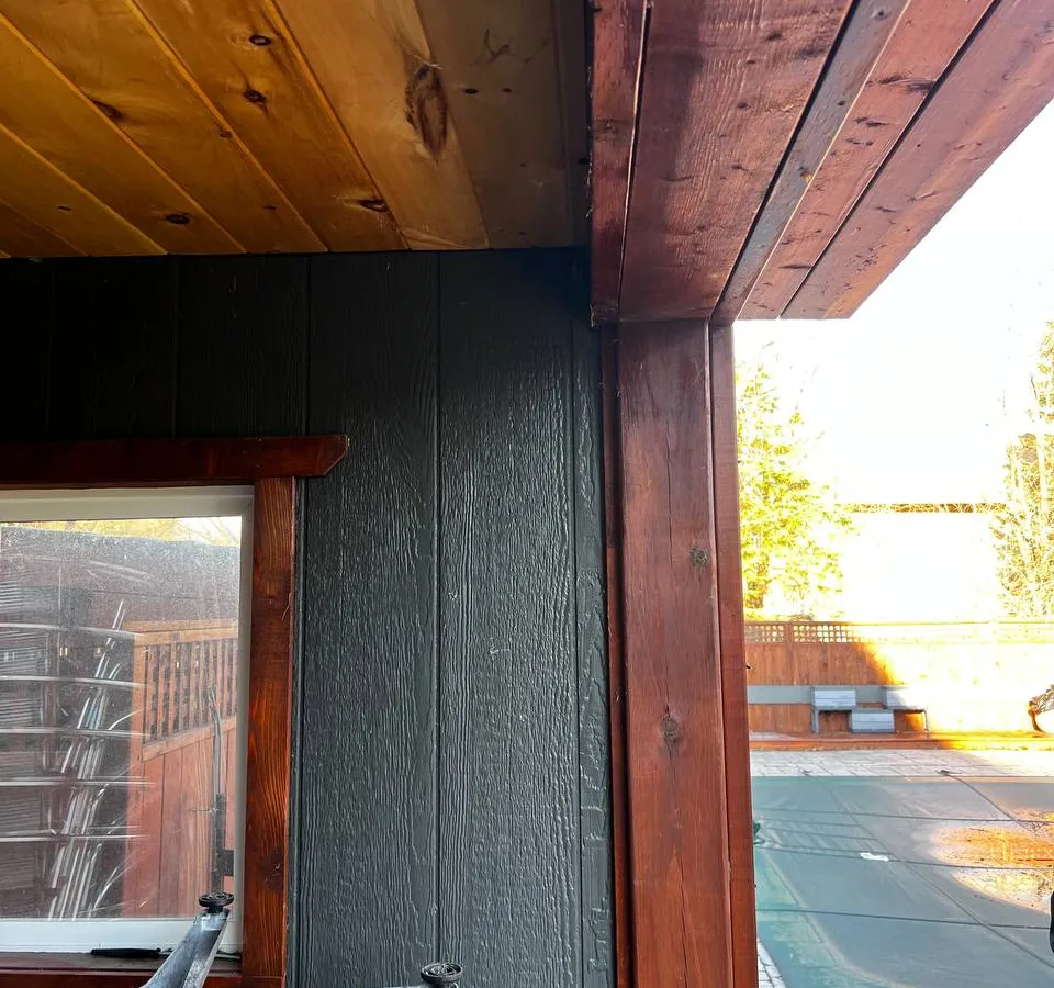 Rustic residential cabana exterior detail showing architectural considerations for security shutter integration